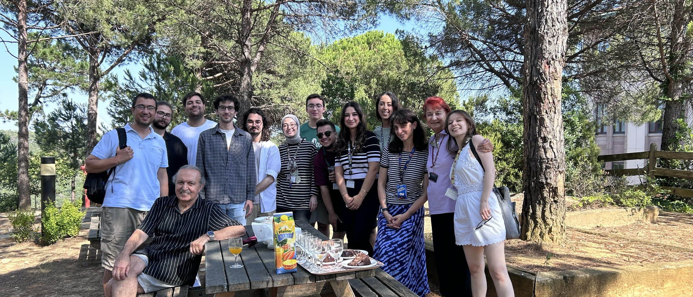 BMDL members gathered outdoors around a picnic table